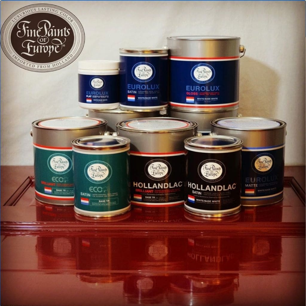 gallons and quart of Fine Paints of Europe products displayed on a surface painted in Fine Paints of europ and the logo in the background